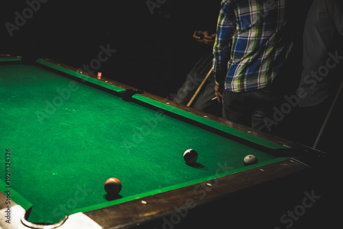 Fotografie Gathered around the pool table