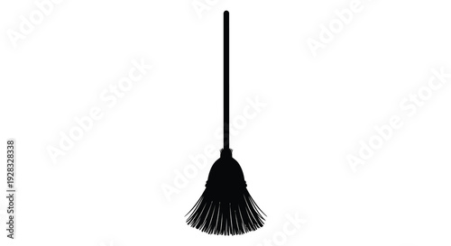 A black broom stands vertically against a white background silhouette