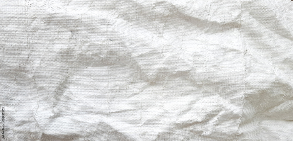 Fototapeta premium Background. Texture of crumpled white burlap. Copy space.