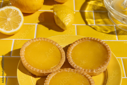Lemon tarts on yellow tile