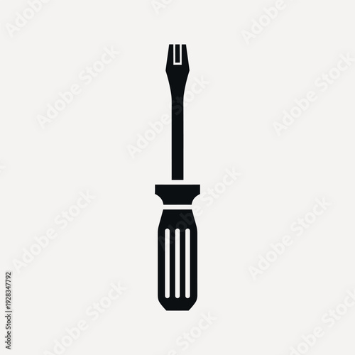 Black silhouette of a flathead screwdriver with a ribbed handle on a light grey background