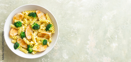 Pasta with chicken and broccoli in a creamy sauce. Italian cuisine.