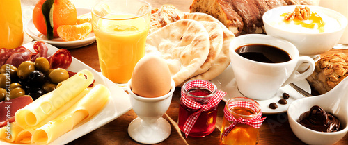 Delicious and healthy breakfast spread with fresh ingredients on table
