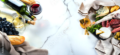 Elegant wine cheese and charcuterie board on marble background