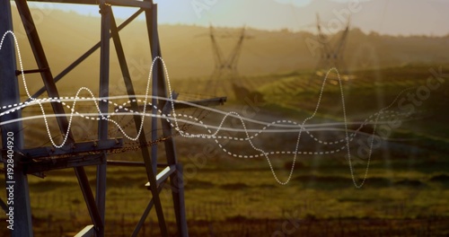 Framing metal lattice tower showing ladder and safety chain in rural fields with waveform overlays