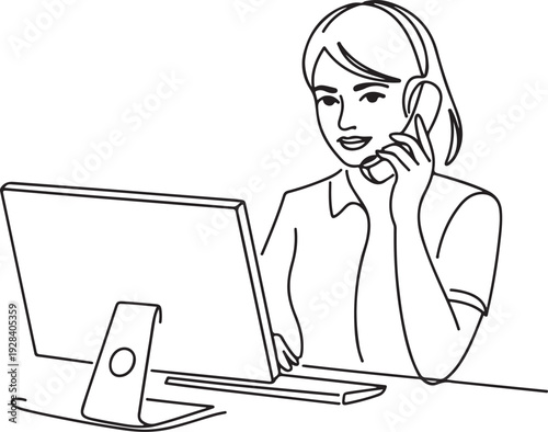 Woman working on computer and talking on phone at desk