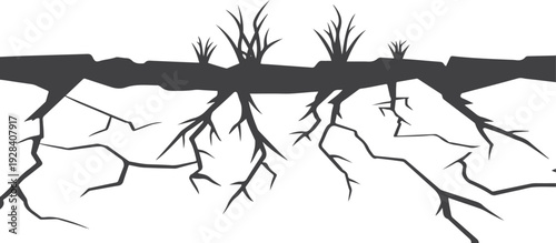 Dark cracked earth with sparse dry grass silhouettes