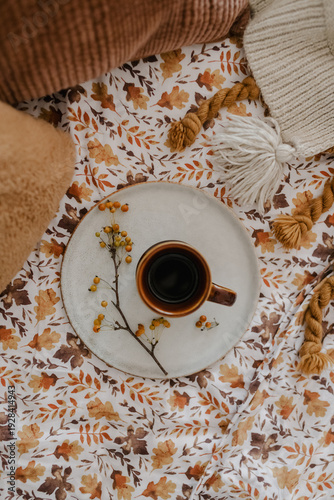 cup of coffee on a bed in the morning 