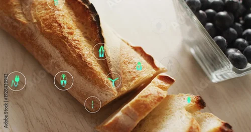 Obraz Displaying sliced crusty baguette resting on light wood with blueberry bowl and green UI icons
