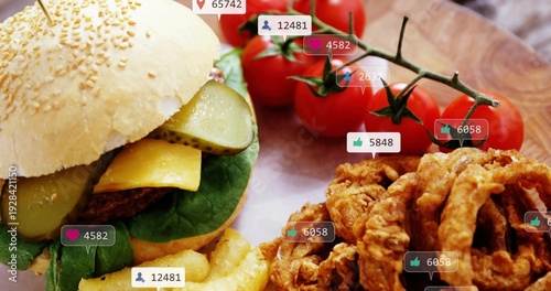 Showing sesame-bun burger sitting on wood board, with crinkle fries, onion rings, social icons