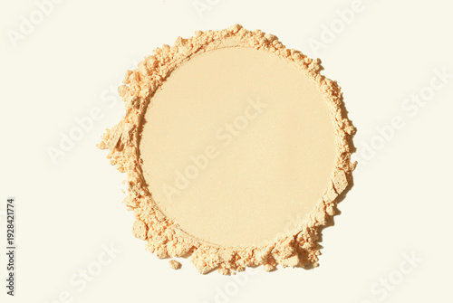 Compact or loose powder beige nude circle shape pressed smudge beige on neutral isolated background