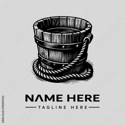 Black and white vintage woodcut illustration of a wooden bucket with rope handle and metal band, against a clean background.