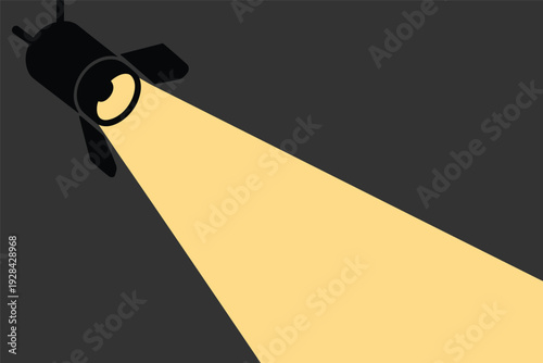 Spotlight shining brightly in dark space with copy space