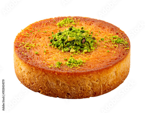 Golden, crispy spun dough dessert topped with green pistachios