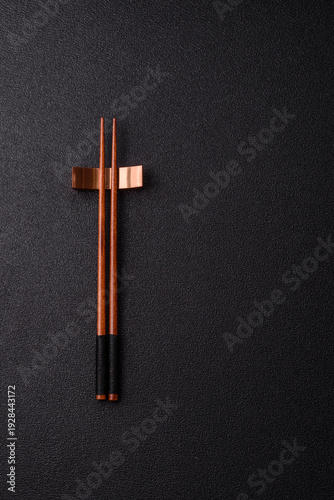Wooden bamboo chopsticks for sushi and other Asian food with a blank background. Wooden chopsticks