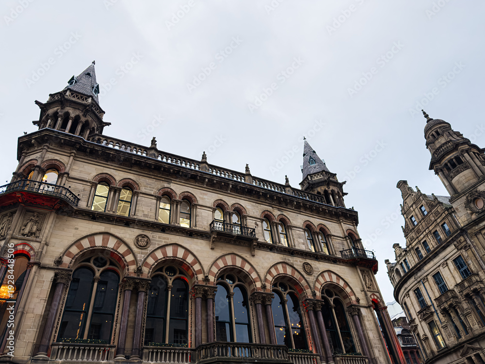 Fototapeta premium Historic Manchester Town Hall style building with arches and towers in the city center, United Kingdom