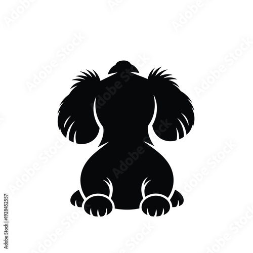 A stylish black silhouette of a sitting dog with floppy ears and a wagging tail Vector