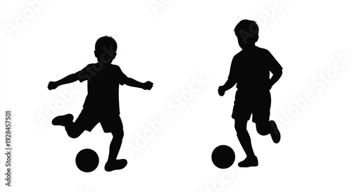Two boys playing with a ball in a dark silhouette