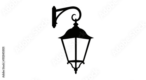 A black silhouette of an ornate vintage wall mounted outdoor lantern