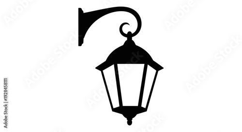 Black silhouette of an ornate outdoor wall mounted lantern on a white background