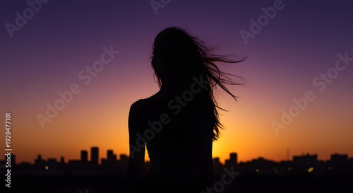Silhouette of a woman with long flowing hair against a vibrant sunset over a city skyline