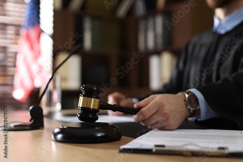 Obraz na plátne Judge striking gavel at table indoors, selective focus