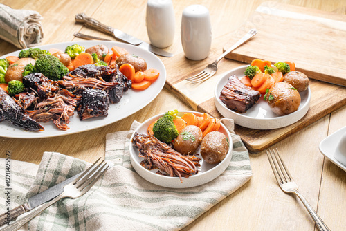Fotografie Hearty Midwestern food. Beef pot roast with carrots and potatoes