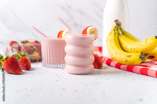 Healthy breakfast smoothie made with fresh organic strawberry and banana fruit