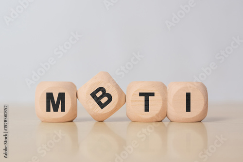 Wallpaper Mural Four wooden blocks with the letters MBTI on the bright surface of a gray table, business conceptual word collected of of wooden elements with the letters Torontodigital.ca