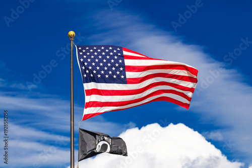 american flag and pow mia flag waving on flagpole in washington dc