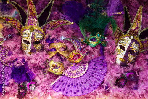 Venetian Carnival Masks with Feathers in Vibrant Purple and Gold