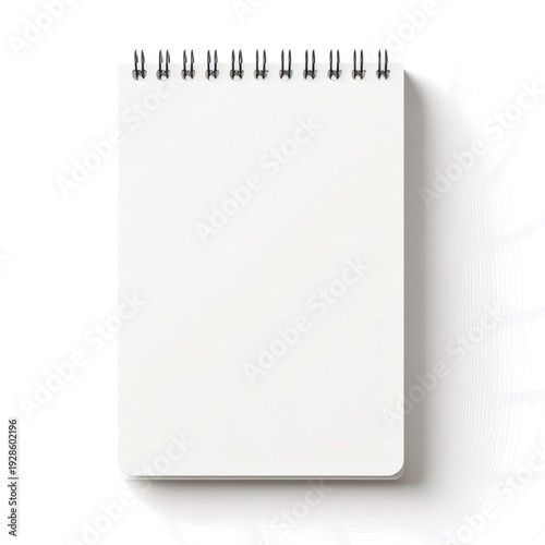 Blank spiral bound notepad mockup featuring clean white pages ready for text or drawing presentation with plenty of copy space 