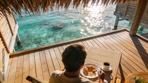 Luxury Breakfast Served on Overwater Villa Deck with Crystal Clear Turquoise Ocean Water View