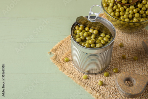 Tin can and glass bowl with...