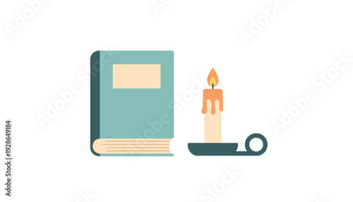 Vintage book with lit candle on holder