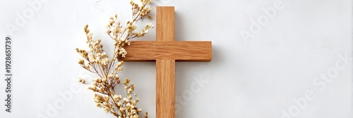 Wooden cross with flowers on it
