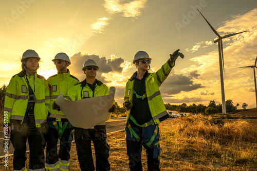 Obraz na płótnie Industrial HSE safety supervisors adhering to strict occupational ppe regulations at sunset