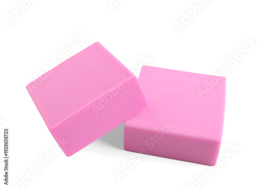 Pink rubber erasers on whit...