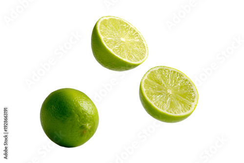 Floating Lime Halves and Whole Lime on Gray Background
