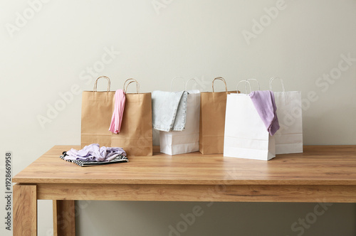 Many paper shopping bags wi...