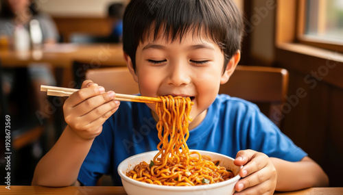 Joyful Noodle Delight: A young child savoring a bowl of delicious noodles with chopsticks, expressing pure joy and contentment. A warm, intimate moment of culinary enjoyment