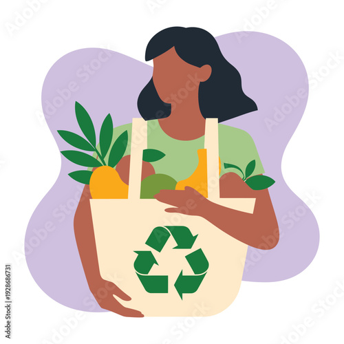 A person carries a reusable shopping bag filled with fresh produce, featuring a recycling symbol.
