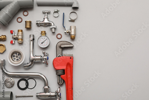 Set of plumber's items on g...