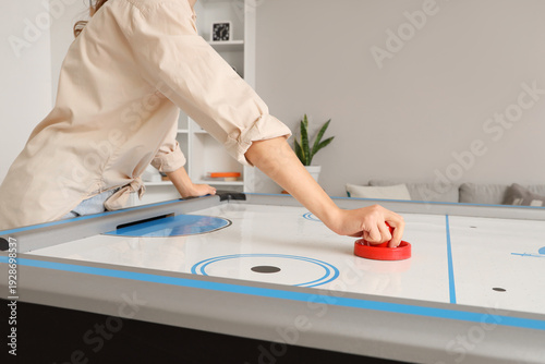 Young woman playing air hoc...
