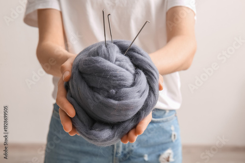 Woman holding wool for felt...