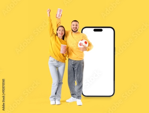 Couple of sports fans with ...