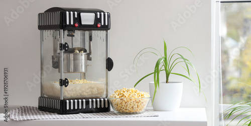 Modern popcorn machine on c...
