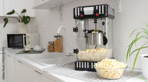 Modern popcorn machine on c...