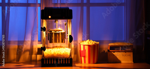 Modern popcorn machine on c...