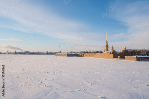 Peter and Paul Fortress and Vasilievsky Island from the Trinity Bridge over the Neva River on a sunny winter morning with clouds, St. Petersburg, Russia